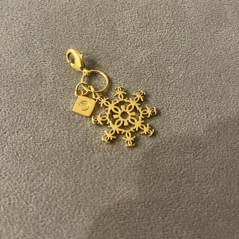 Authentic Chanel holiday snowflake gold charm